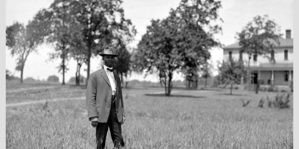 Wallace Battle in front of the president’s home on the Okolona Campus in 1916.